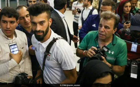 Iran Footballer Faces Questioning Over Controversial 'Hug' With Female Fan